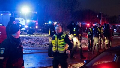 Lithuanian law enforcement officers work at the crash site of a cargo plane near the Vilnius International Airport in Vilnius. (AFP) Lithuanian law enforcement officers work at the crash site of a cargo plane near the Vilnius International Airport in Vilnius. (AFP)