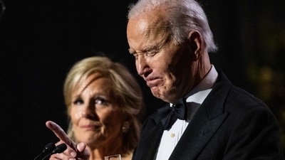 US President Joe Biden gets emotional as he speaks, alongside US First Lady Jill Biden, during a dinner to thank longtime supporters on the South Lawn of the White House in Washington, DC, on November 21, 2024. (AFP /  ANDREW CABALLERO-REYNOLDS)