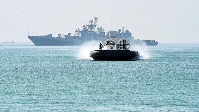 An Indian Coast Guard hovercraft (front) and Indian Navy's national hospital ship (NHS) participate during Sanyukt Vimochan 2024, a multilateral joint exercise in Porbandar in November 2024. (AFP/Representative)