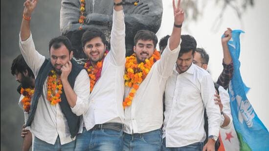 NSUI candidate Ronak Khatri (president) with Lokesh Chaudhary (joint secretary) celebrate after winning in the Delhi University Students Union (DUSU) elections at Delhi University north campus in New Delhi on Monday. (RAJ K RAJ /HT PHOTO)