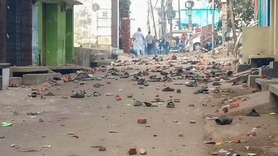Sambhal: Footwears and brick bats lying on a road after violence erupted during the second survey of the Jama Masjid. (PTI)