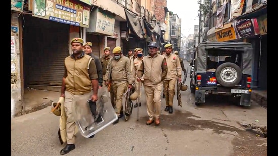 Security personnel deployed outside the Jama Masjid to maintain law and order in Sambhal on Monday. (PTI)