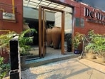 Pieces of broken window glass lie on the floor after an explosion outside a club in Chandigarh on Tuesday. (PTI Photo) 