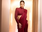 Kriti Sanon's recent red saree look sparked mixed reactions, with Diet Sabya humorously criticizing the look. Kriti Sanon's recent red saree look sparked mixed reactions, with Diet Sabya humorously criticizing the look.
