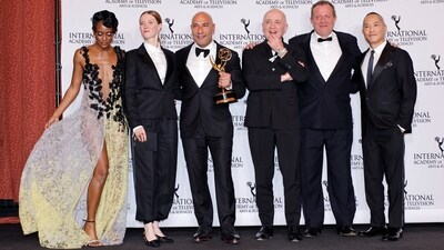 Fleur Geffrier, Sam Kozhaya and Alfred Lot pose with the Drama Series award for Les Gouttes de Dieu [Drops of God] with presenters Skye P Marshall and Ken Leung at the 52nd International Emmy Awards in New York City. 
