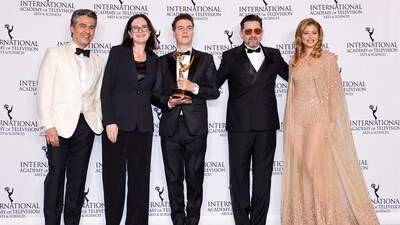 Ramon Campos Saez and Josep Cister Rubio pose with the Telenovela award for La Promesa [The Vow] with presenters Isadora Cruz and Armin Amiri at the 52nd International Emmy Awards. 