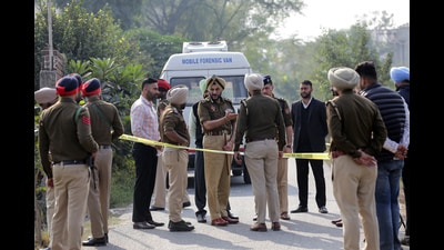 Amritsar police commissioner Gurpreet Singh Bhullar with other police officials at the site of the incident where a criminal tried to assault policemen after snatching his rifle on the outskirts of Amritsar on Tuesday. (ANI)