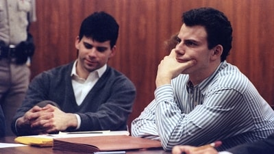 Erik Menendez (R) and brother Lyle listen to court proceedings during a May 17, 1991, appearance in the case of the shotgun murder of their wealthy parents in August 1989. (Reuters / Lee Celano)