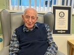 John Alfred Tinniswood poses for a photo on April 4, 2024. The world’s oldest man has died in England at age 112. The family of John Alfred Tinniswood said he died Monday, Nov. 25, 2024 at a care home outside Liverpool, where he was born in 1912.