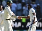 Australia's Josh Hazlewood shakes hands with India's Jasprit Bumrah after the Perth Test