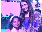 Aishwarya Rai posed with a young fan and addressed the audience at the event. Aishwarya Rai posed with a young fan and addressed the audience at the event.