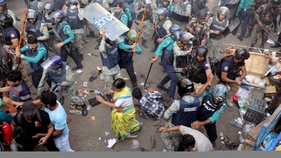 Policemen charge baton to disperse the supporters of Bangladeshi Hindu leader Krishna Das Prabhu (AP) Policemen charge baton to disperse the supporters of Bangladeshi Hindu leader Krishna Das Prabhu (AP)
