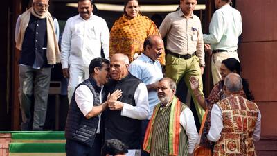 BJP MP and Waqf Amendment Bill JPC chairman Jagdambika Pal interacts with Congress MP Hibi Eden at Parliament House during the Winter Session in New Delhi on Wednesday. (ANI)