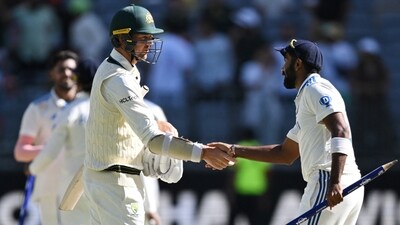 Australia's Josh Hazlewood shakes hands with India's Jasprit Bumrah after the Perth Test (AAP Image via REUTERS)