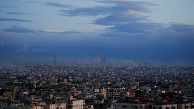 A view of Beirut's southern suburbs and its surroundings, with smoke rising from Israeli strikes that occurred before the ceasefire, as seen from Deir Qoubel. (REUTERS)