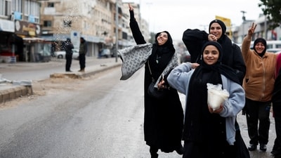 Women welcome the people coming back to Tyre, after a ceasefire between Israel and Hezbollah. (REUTERS)