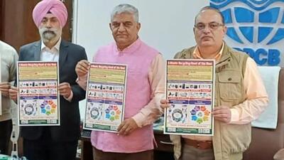 PPCB chairman Adarsh Pal Vig (centre) during the release of the e-waste poster. (HT Photo)