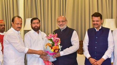 Mumbai: Maharashtra Governor C.P. Radhakrishnan being greeted by Shiv Sena leader Eknath Shinde as BJP leader Devendra Fadnavis and NCP leader Ajit Pawar look on, in Mumbai, Tuesday, Nov. 26, 2024. Shinde on Tuesday submitted his resignation as Maharashtra chief minister to the governor, who asked Shinde to act as a caretaker chief minister till a new CM is sworn in. (PTI) Mumbai: Maharashtra Governor C.P. Radhakrishnan being greeted by Shiv Sena leader Eknath Shinde as BJP leader Devendra Fadnavis and NCP leader Ajit Pawar look on, in Mumbai, Tuesday, Nov. 26, 2024. Shinde on Tuesday submitted his resignation as Maharashtra chief minister to the governor, who asked Shinde to act as a caretaker chief minister till a new CM is sworn in. (PTI)