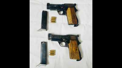 Two .32 calibre pistols, along with seven cartridges, were recovered from the possession of the duo. (HT Photo) Two .32 calibre pistols, along with seven cartridges, were recovered from the possession of the duo. (HT Photo)
