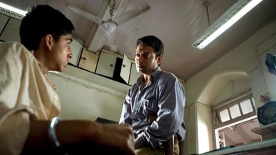 Irrfan Khan and Dev Patel in a still from Slumdog Millionaire. Irrfan Khan and Dev Patel in a still from Slumdog Millionaire.