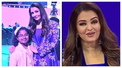 Aishwarya Rai posed with a young fan and addressed the audience at the event. Aishwarya Rai posed with a young fan and addressed the audience at the event.