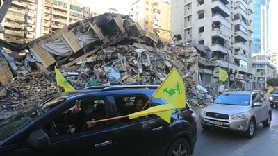 Motorists wave the flag of Hezbollah as they parade in Beirut's southern suburbs on November 27, 2024, after a ceasefire between Israel and Hezbollah took effect. (AFP) Motorists wave the flag of Hezbollah as they parade in Beirut's southern suburbs on November 27, 2024, after a ceasefire between Israel and Hezbollah took effect. (AFP)