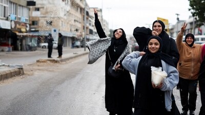 Women welcome the people coming back to Tyre, after a ceasefire between Israel and Hezbollah. (REUTERS)