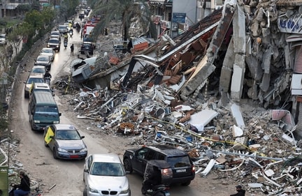 Vehicles drive near damaged buildings in Beirut's southern suburbs, after a ceasefire between Israel and Hezbollah took effect, Lebanon November 27, 2024. (REUTERS)