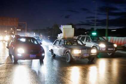 A vehicle transporting mattresses drives towards southern Lebanon on a highway. (REUTERS)