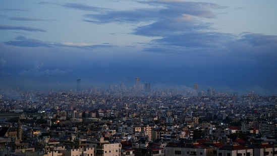 A view of Beirut's southern suburbs and its surroundings, with smoke rising from Israeli strikes that occurred before the ceasefire, as seen from Deir Qoubel.(REUTERS)