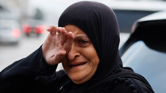 A woman in Lebanon's Tyre reacts after arriving in the city, after a ceasefire between Israel and Iran-backed group Hezbollah took effect.(REUTERS)