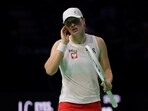 Poland's Iga Swiatek reacts during her match against Italy's Jasmine Paolini