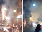 In a terrifying video, a man can be seen emerging from a car's sunroof and lighting up rockets to shoot into the air.