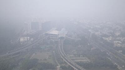 A thick layer of smog engulfs the city of Noida. (PTI) A thick layer of smog engulfs the city of Noida. (PTI)