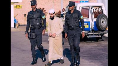 Lashkar-e-Taiba operative Salman Khan with Rwanda security personnel before his extradition. (Photo from X) Lashkar-e-Taiba operative Salman Khan with Rwanda security personnel before his extradition. (Photo from X)