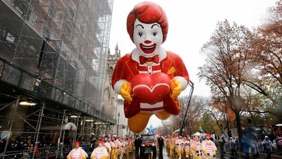 The Ronald McDonald balloon flies during the 98th Macy's Thanksgiving Day Parade. This year's parade features new Spider-Man and Minnie Mouse balloons, zoo and pasta-themed floats, an ode to Big Apple coffee and bagels (REUTERS)