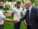 Australian Prime Minister Anthony Albanese, right, shakes hands with Indian cricketer Virat Kohli during a reception at Parliament House in Canberra.