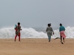 Cyclone Fengal: People look at the high tides lashing at Marina beach as Tamil Nadu braces for Cyclone Fengal in Chennai on Thursday. Cyclone Fengal: People look at the high tides lashing at Marina beach as Tamil Nadu braces for Cyclone Fengal in Chennai on Thursday.