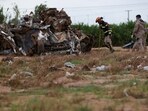 Soldiers search for bodies following rains and flash floods that caused rivers to overflow in Valencia and other parts of Spain, in the Poyo ravine in Quart de Poblet, Valencia, Spain, November 13, 2024.