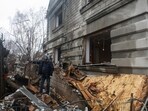 A resident stands next to his house damaged by a Russian drone strike outside Odesa, Ukraine. 