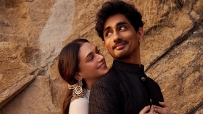 Aditi Rao Hydari stunned in a handwoven Maheshwari tissue lehenga complemented by a Benarasi dupatta. Siddharth matched her elegance in a silk kurta and handwoven dhoti. Aditi Rao Hydari stunned in a handwoven Maheshwari tissue lehenga complemented by a Benarasi dupatta. Siddharth matched her elegance in a silk kurta and handwoven dhoti.