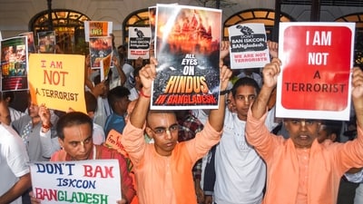 People holding placards take part in a protest rally against the arrest of ISKCON monk Chinmay Prabhu by Dhaka police. (ANI) People holding placards take part in a protest rally against the arrest of ISKCON monk Chinmay Prabhu by Dhaka police. (ANI)