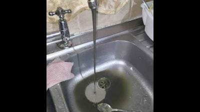 Dirty water supply in a house in Bhagwan Nagar Colony.