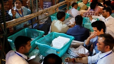 Election officials count postal ballots. Representative Image. (REUTERS) Election officials count postal ballots. Representative Image. (REUTERS)