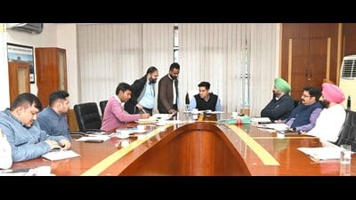MC officials during a review meeting regarding the Buddha Nullah rejuvenation project in Ludhiana on Friday. (HT Photo)