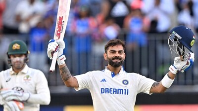 Virat Kohli celebrates reaching his century (100 runs) during day three of the first Test cricket match between Australia and India (AFP) Virat Kohli celebrates reaching his century (100 runs) during day three of the first Test cricket match between Australia and India (AFP)