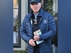 President Biden can be seen hoding the book "The Hundred Years' War on Palestine" by Rashid Khalidi as he walks out of Nantucket Bookworks in Nantucket, Mass. 