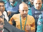 Chinmoy Krishna Das, a Hindu leader associated with ISKON, who faces several charges, is escorted by the police at the Chattogram Metropolitan Magistrate Court, in Chattogram, Bangladesh. (REUTERS) (File)