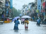 People wade through a flooded street as it rains ahead of a cyclonic storm in Chennai on November 30, 2024. People wade through a flooded street as it rains ahead of a cyclonic storm in Chennai on November 30, 2024.