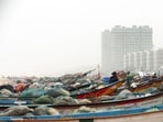 Fishing boats docked at the marina shore as Tamil Nadu braces for Cyclone Fengal, at Marina Beach in Chennai 